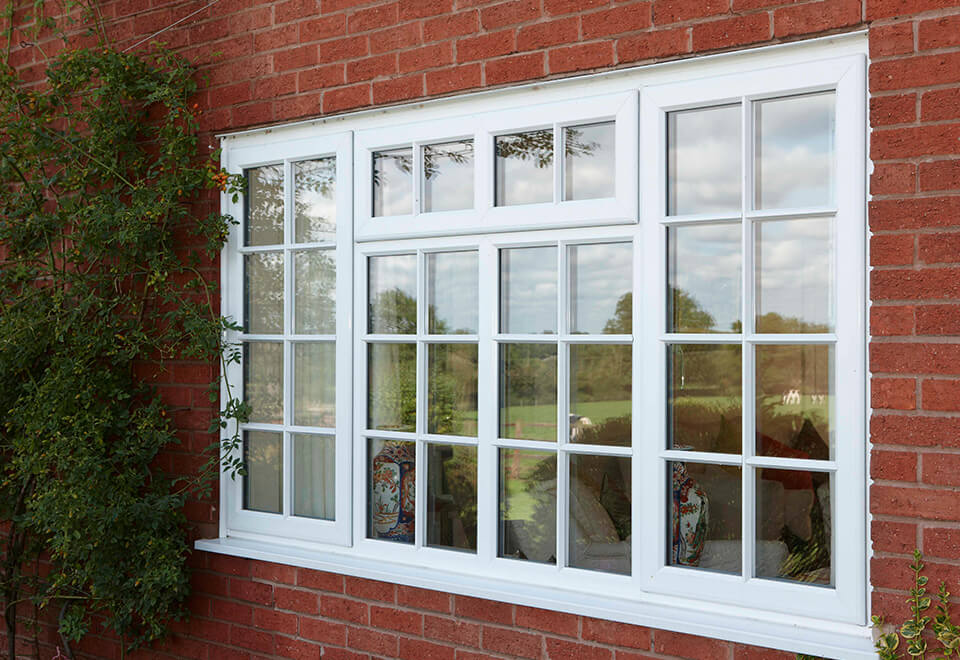 White uPVC casement window with astragal bars